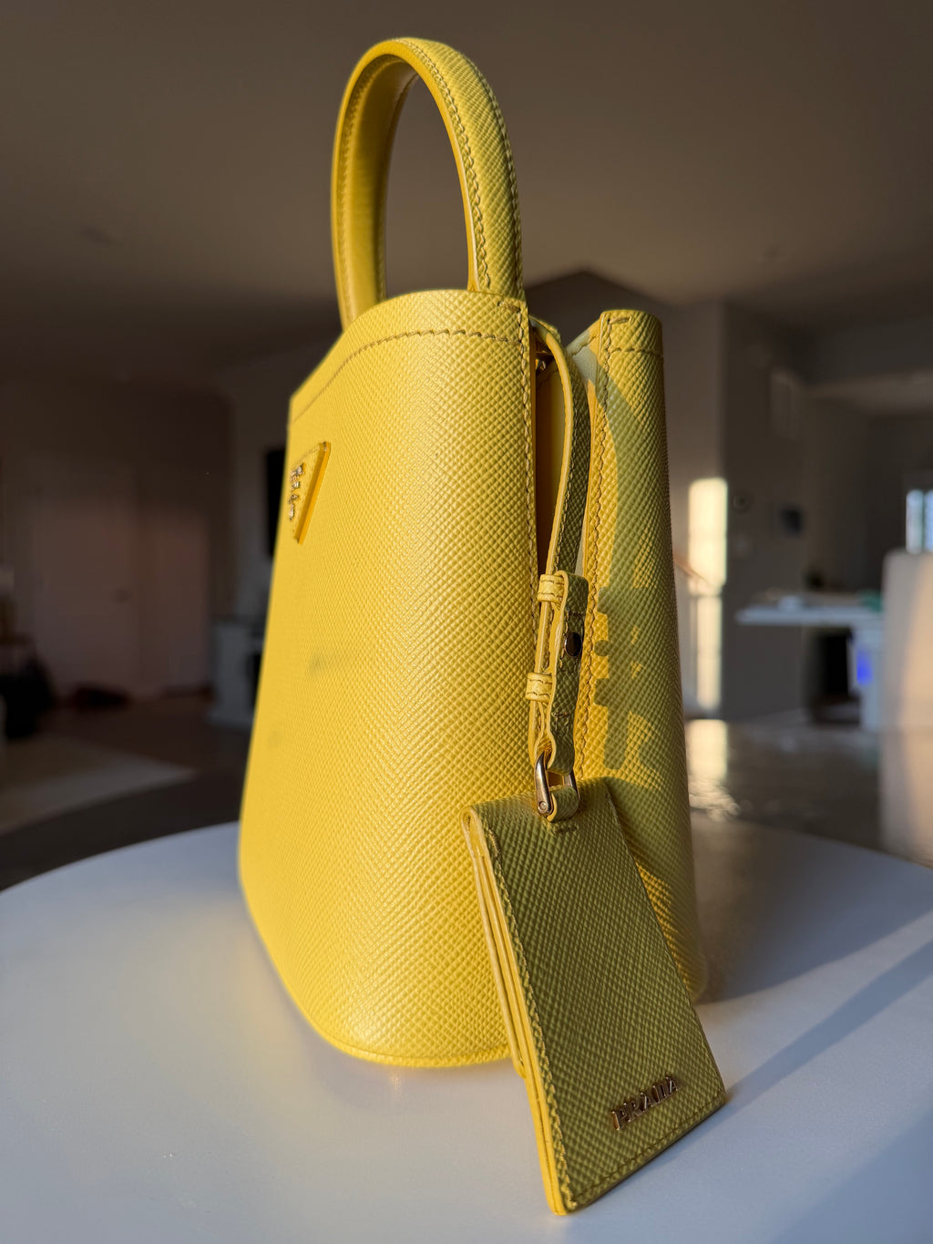 Prada Yellow Bucket (no wear on the leather, it’s a glare from the Sun!)
